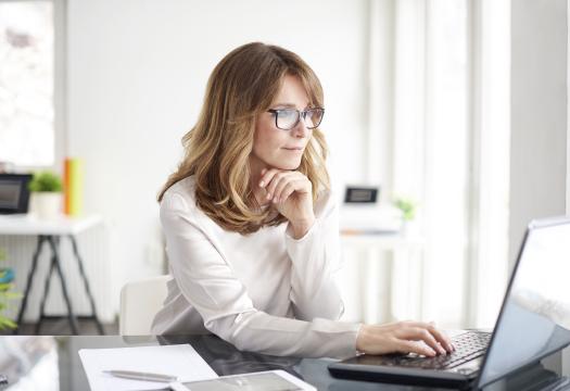 Woman works on her laptop
