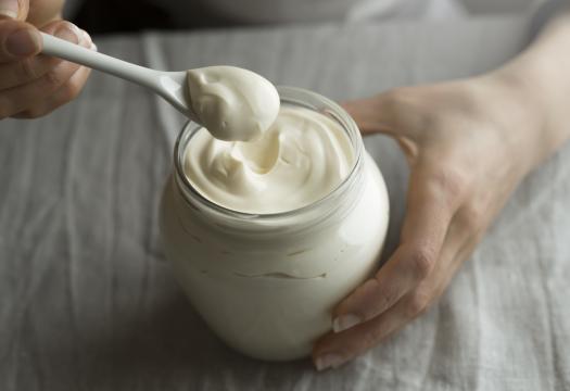 Woman uses Mayonnaise  as a cleaning product