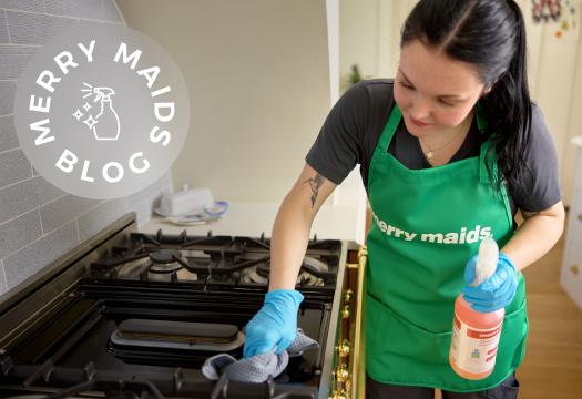 Woman cleaning in kitchen