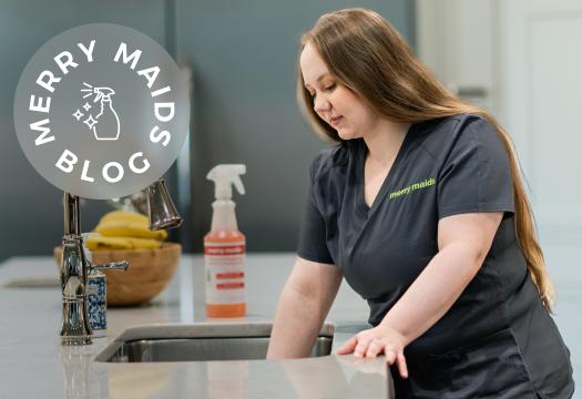 Woman cleaning garbage disposal